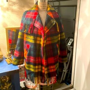 Beautiful plaid wool jacket with fringe detail. Made in Scotland.